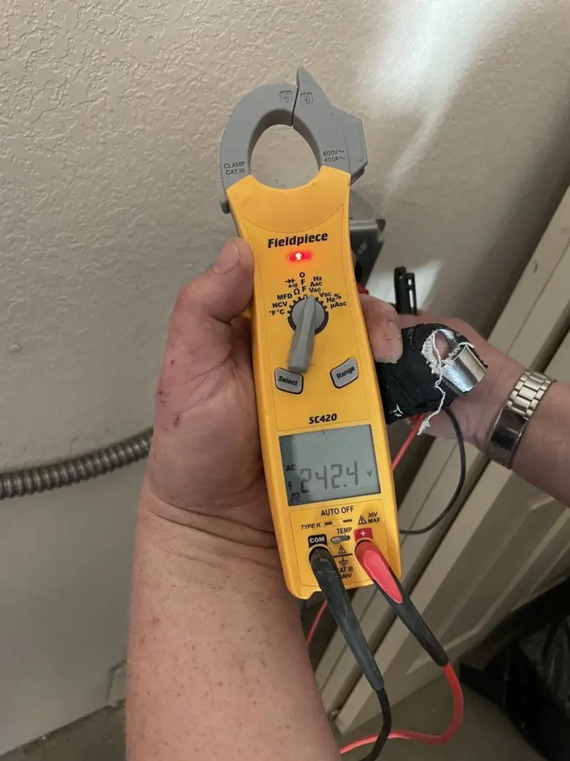 Voltage testing with clamp meter during Generator Installation in Portage Lakes